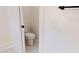 An inside view of the toilet area in the bathroom with white paint and tile flooring at 974 Crooked Oak Dr., Pawleys Island, SC 29585