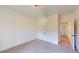 Carpeted bedroom with white walls, closet, and door leading to the hallway at 974 Crooked Oak Dr., Pawleys Island, SC 29585
