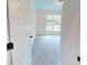 Bedroom with neutral carpeting, white walls, and a view to the outside at 974 Crooked Oak Dr., Pawleys Island, SC 29585