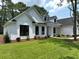 Beautifully landscaped front yard highlighting the home's architectural details at 974 Crooked Oak Dr., Pawleys Island, SC 29585
