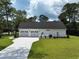 Aerial view featuring the garage and a spacious driveway at 974 Crooked Oak Dr., Pawleys Island, SC 29585