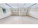 Spacious two car garage with finished concrete floor and doors with windows at 974 Crooked Oak Dr., Pawleys Island, SC 29585
