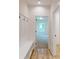 Hallway with coat hooks and bench with cubbies at 974 Crooked Oak Dr., Pawleys Island, SC 29585