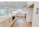 Modern kitchen featuring white cabinets, quartz countertops, and stainless steel appliances at 974 Crooked Oak Dr., Pawleys Island, SC 29585