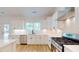 Well-equipped kitchen with white cabinets, quartz countertops, and stainless steel appliances at 974 Crooked Oak Dr., Pawleys Island, SC 29585