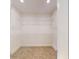 Spacious walk-in closet with wire shelving and neutral carpeting at 974 Crooked Oak Dr., Pawleys Island, SC 29585
