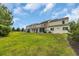 Spacious green backyard featuring a lawn and the back of townhomes at 1001 Dinger Ct. # 1001, Myrtle Beach, SC 29588