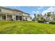 Grassy backyard behind townhomes with neutral siding at 1001 Dinger Ct. # 1001, Myrtle Beach, SC 29588