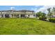 Townhome backyard with lush green lawn and minimal landscaping at 1001 Dinger Ct. # 1001, Myrtle Beach, SC 29588