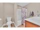 Full bathroom with marble shower curtain and decorative seahorse hooks at 1001 Dinger Ct. # 1001, Myrtle Beach, SC 29588