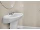 Well-lit half-bathroom featuring a sleek, pedestal sink at 1001 Dinger Ct. # 1001, Myrtle Beach, SC 29588