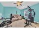 Multi-purpose bedroom setup including workout equipment, couch, desk, and neutral carpet at 1001 Dinger Ct. # 1001, Myrtle Beach, SC 29588
