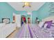 Bright bedroom with a plush queen bed, turquoise walls, and access to a walk-in closet for ample storage at 1001 Dinger Ct. # 1001, Myrtle Beach, SC 29588