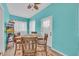 Cozy dining area featuring a wooden table set, natural light, and colorful accent rug at 1001 Dinger Ct. # 1001, Myrtle Beach, SC 29588