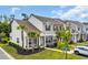 Beautiful townhomes showcasing well-maintained landscaping and stylish exteriors under a blue sky at 1001 Dinger Ct. # 1001, Myrtle Beach, SC 29588