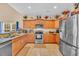 Spacious kitchen featuring granite countertops, stainless steel appliances, and wood cabinetry providing ample storage at 1001 Dinger Ct. # 1001, Myrtle Beach, SC 29588