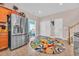Bright kitchen featuring a stainless steel refrigerator and access to a dining area with colorful decor at 1001 Dinger Ct. # 1001, Myrtle Beach, SC 29588