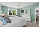 Airy bedroom with a large white bed, neutral walls, a window and large dresser at 1007 Oak Marsh Ln., North Myrtle Beach, SC 29582