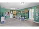 Large, carpeted bonus room featuring lots of wall decor, comfortable seating, and plenty of space at 1007 Oak Marsh Ln., North Myrtle Beach, SC 29582