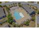 Aerial shot of a neighborhood pool offering lounge chairs, tables, and a covered gathering area at 1007 Oak Marsh Ln., North Myrtle Beach, SC 29582