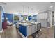 Open-concept kitchen with granite counters, island seating, and stainless steel appliances at 1007 Oak Marsh Ln., North Myrtle Beach, SC 29582
