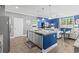 Kitchen island with granite countertops and stainless steel appliances overlooking open living space at 1007 Oak Marsh Ln., North Myrtle Beach, SC 29582