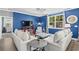 Cozy living room with plush seating, a fireplace, and a large window at 1007 Oak Marsh Ln., North Myrtle Beach, SC 29582
