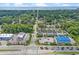 Wide aerial view highlighting the home's proximity to the beach, surrounding trees, and neighborhood amenities at 1011 Sable Palm Way, Surfside Beach, SC 29575