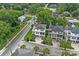 Aerial shot showcasing the home's location and neighborhood with tree lined streets and well maintained homes at 1011 Sable Palm Way, Surfside Beach, SC 29575