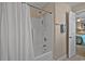 Bright bathroom features a shower and tub combo with white tile and neutral colored walls at 1011 Sable Palm Way, Surfside Beach, SC 29575