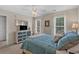 Bright bedroom featuring a ceiling fan, two windows and nautical themed dresser with mirror at 1011 Sable Palm Way, Surfside Beach, SC 29575