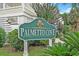 Palmetto Cove community sign surrounded by lush landscaping at 1011 Sable Palm Way, Surfside Beach, SC 29575
