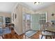 Inviting entryway with transom windows above the door, leading into an open floor plan with hardwood floors at 1011 Sable Palm Way, Surfside Beach, SC 29575