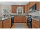 Well-equipped kitchen featuring granite countertops, stainless steel appliances, and ample cabinet space at 1011 Sable Palm Way, Surfside Beach, SC 29575