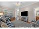 Comfortable living room with hardwood floors, ceiling fan, neutral walls, and a view to the dining area at 1011 Sable Palm Way, Surfside Beach, SC 29575