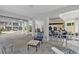 Inviting outdoor area under the house with a concrete floor, pillars, comfortable seating and golf cart at 1011 Sable Palm Way, Surfside Beach, SC 29575