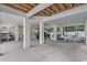 Spacious outdoor area with concrete flooring, support pillars, and seating for relaxing or entertaining at 1011 Sable Palm Way, Surfside Beach, SC 29575