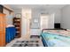 Comfortable bedroom features a bed, a bookshelf, ceiling fan, and a cozy atmosphere with natural light at 106 Scotch Broom Dr. # 105, Little River, SC 29566