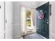 Open front door reveals a bright entrance to the home's interior at 106 Scotch Broom Dr. # 105, Little River, SC 29566