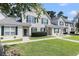 Well-maintained townhomes with green shutters and lush green lawn at 106 Scotch Broom Dr. # 105, Little River, SC 29566