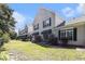 Charming townhomes with awnings, dark shutters, and a lush green lawn under a beautiful blue sky at 106 Scotch Broom Dr. # 105, Little River, SC 29566