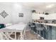 Kitchen with granite countertops, breakfast bar, and an adjacent dining area at 106 Scotch Broom Dr. # 105, Little River, SC 29566