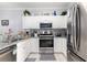 Bright kitchen featuring granite countertops, stainless steel appliances and tile floors at 106 Scotch Broom Dr. # 105, Little River, SC 29566