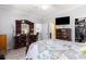 Bright main bedroom offering a large dresser with mirror, ensuite bath, and spacious closet at 106 Scotch Broom Dr. # 105, Little River, SC 29566
