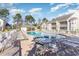 Inviting community pool with plenty of lounge chairs and outdoor seating for residents' enjoyment at 106 Scotch Broom Dr. # 105, Little River, SC 29566
