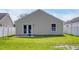 A home's backyard with green grass and an off-white fence at 1077 Stoney Falls Blvd., Myrtle Beach, SC 29579