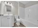 This bathroom has a white sink and toilet with light wood floors at 1077 Stoney Falls Blvd., Myrtle Beach, SC 29579