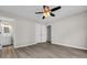 This is a bedroom with light grey walls, light wood floors and a double closet at 1077 Stoney Falls Blvd., Myrtle Beach, SC 29579
