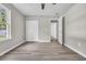 This is a bedroom with grey wood floors and a white closet at 1077 Stoney Falls Blvd., Myrtle Beach, SC 29579