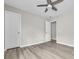 Neutral bedroom featuring wood-look floors, a ceiling fan, and two entry doors at 1077 Stoney Falls Blvd., Myrtle Beach, SC 29579